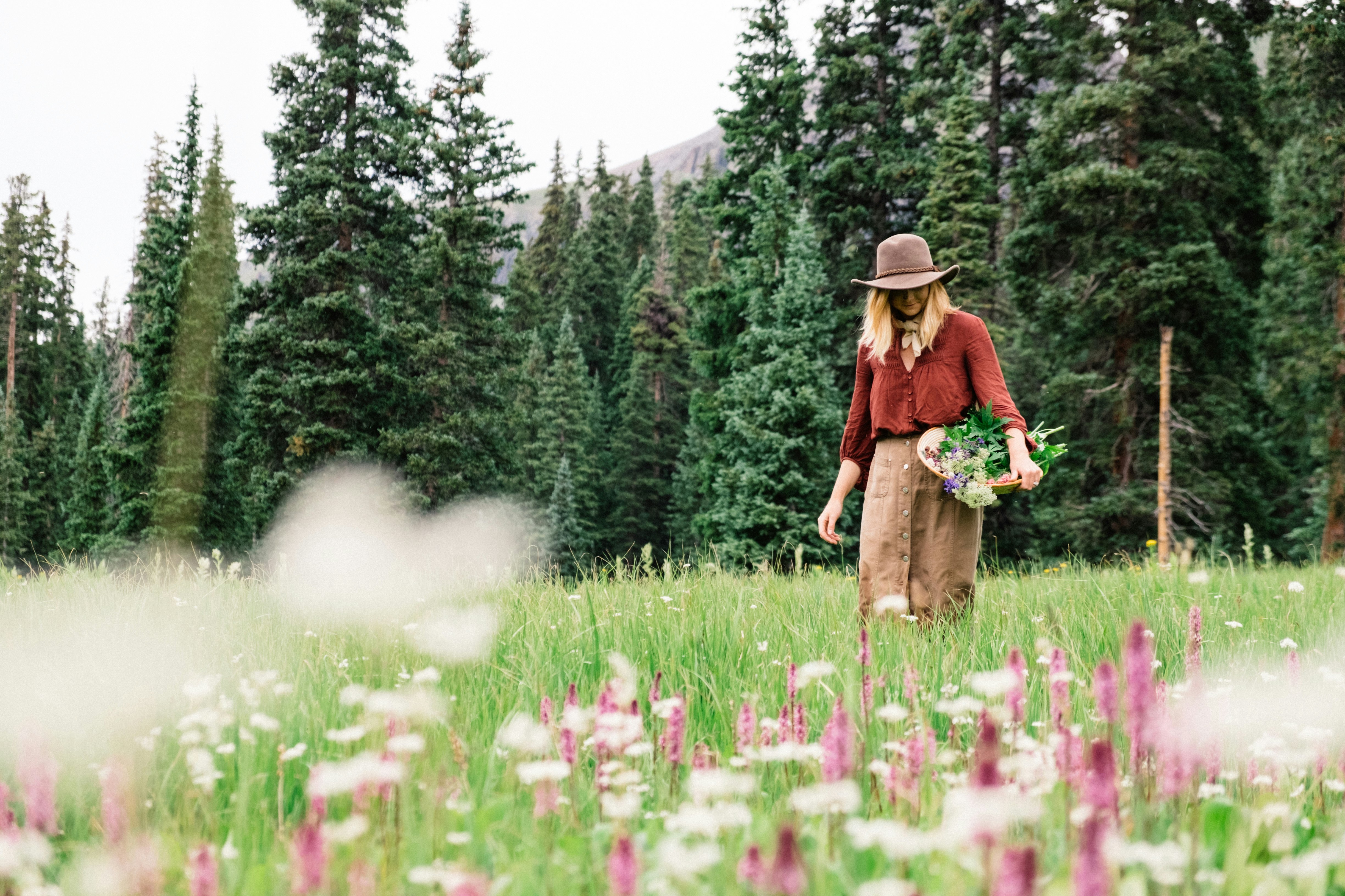 woman collecting flowers