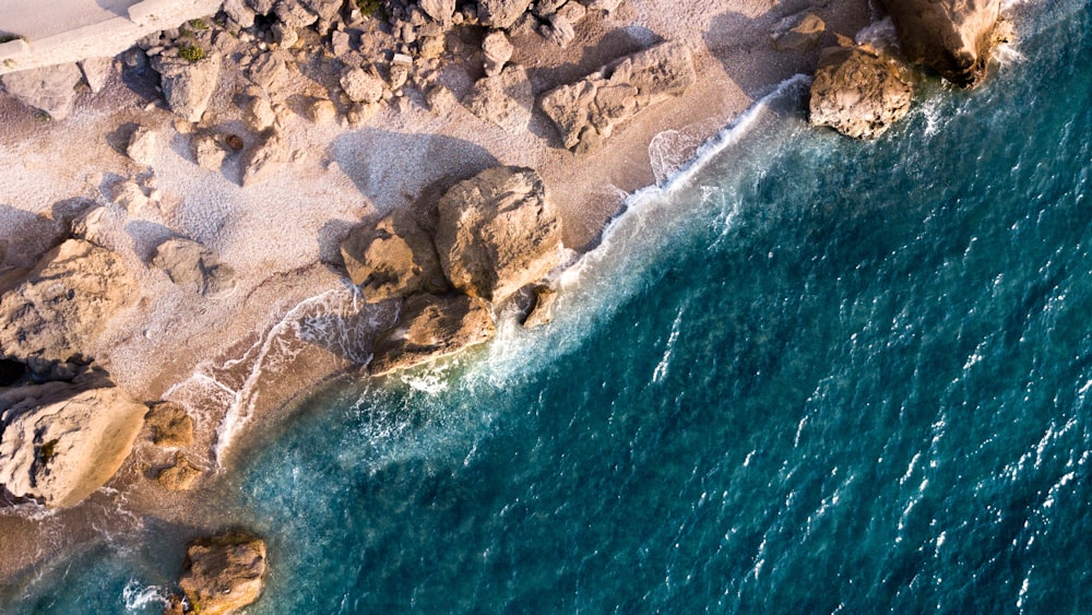 rock formation on shore during day