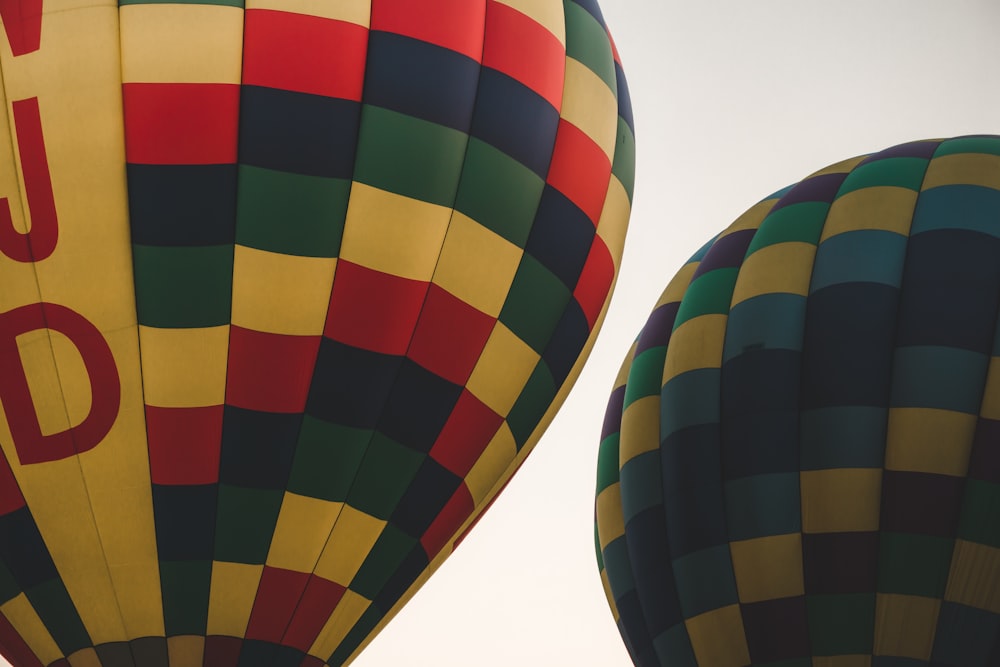 two multicolored hot air balloons