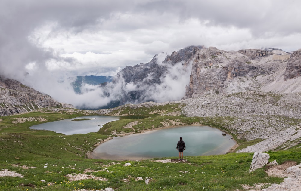 person standing near body of water