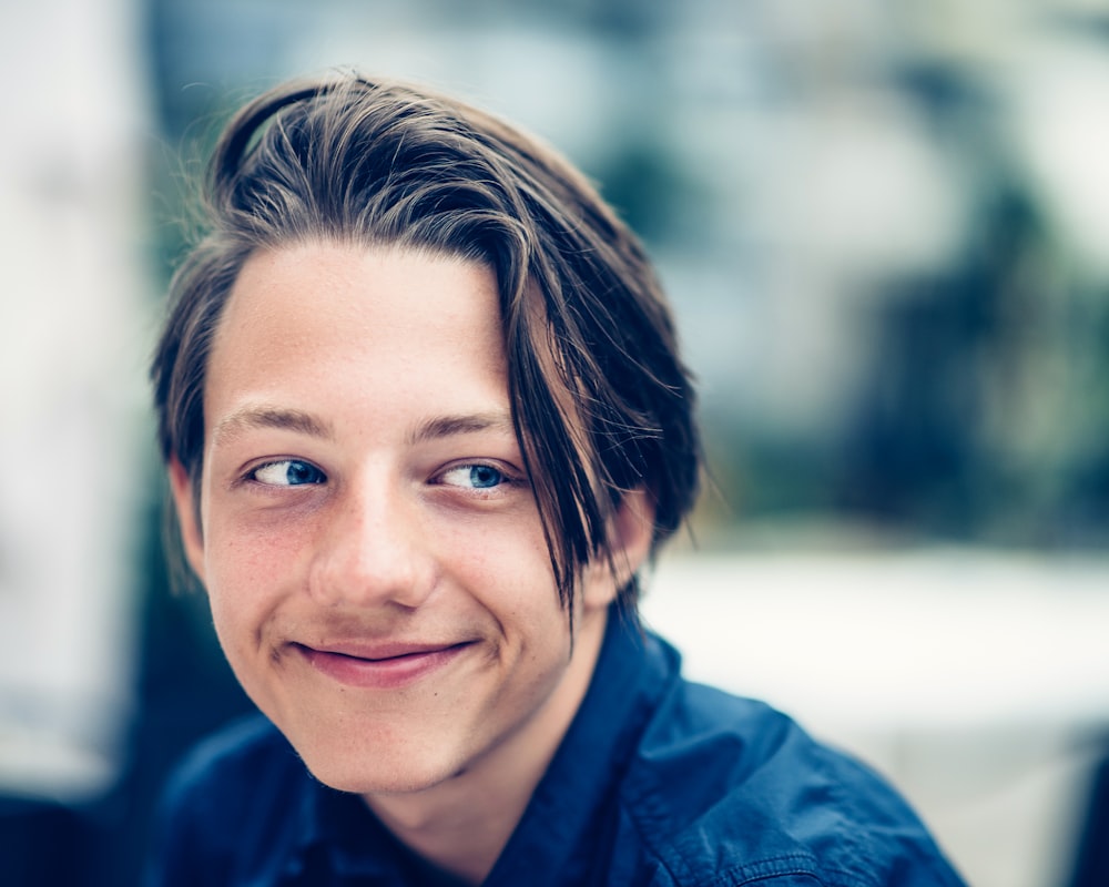 man wearing collared shirt in closeup photography