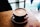latte art in brown cup in macro photography