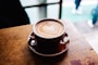 latte art in brown cup in macro photography