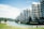 Modern apartment buildings line a waterway with several floors of balconies, surrounded by greenery and palm trees. The sky is clear with few clouds, and there is a blurred effect giving a dreamy aesthetic.