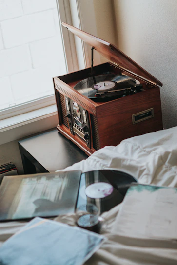 A beautifully crafted record player table in a cozy setting.