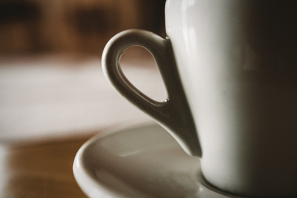 white ceramic mug and saucer