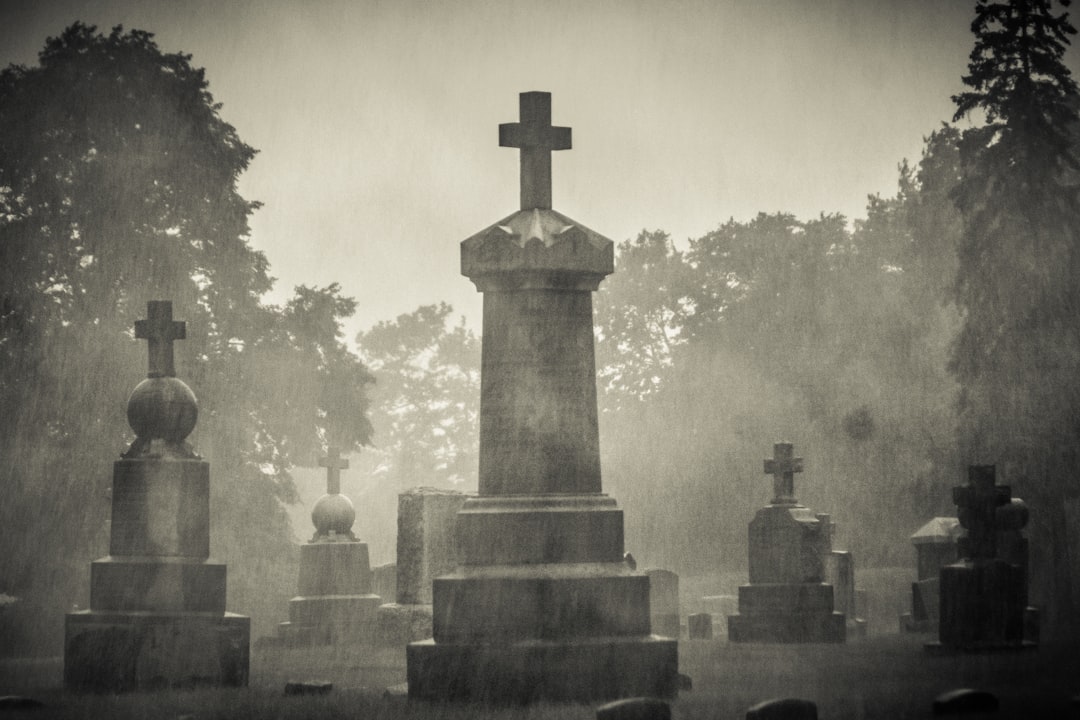gray concrete cross on gray concrete blocks, R.I.P