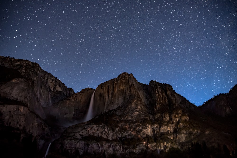 waterfalls on rock cliff