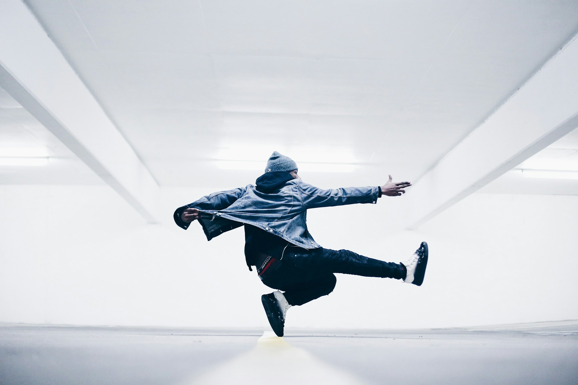 A hip hop dancer mid-move in the studio
