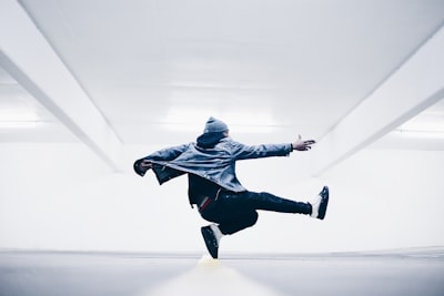 man jumping in the middle taken at daytime dance google meet background