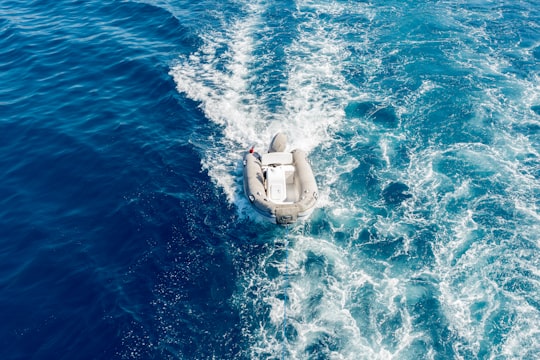 white inflatable boat on body of water during daytime in Marmaris Turkey