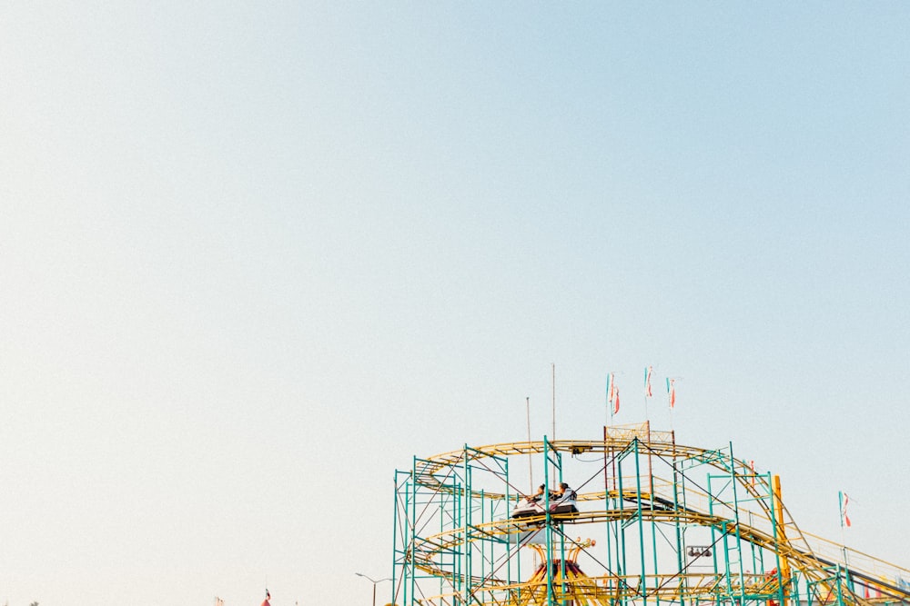 a roller coaster with a sky background