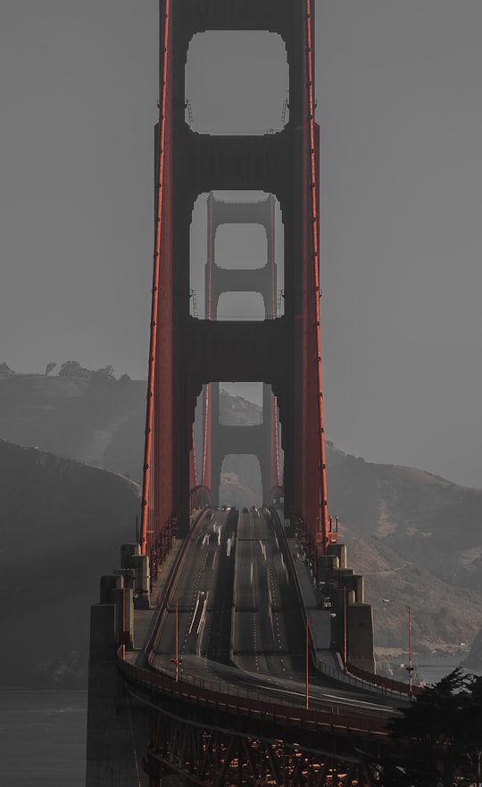 shallow focus photo of maroon bridge in Golden Gate National Recreation Area United States