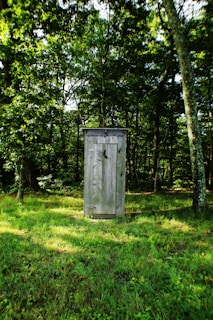 gray wooden outdoor portable bathroom