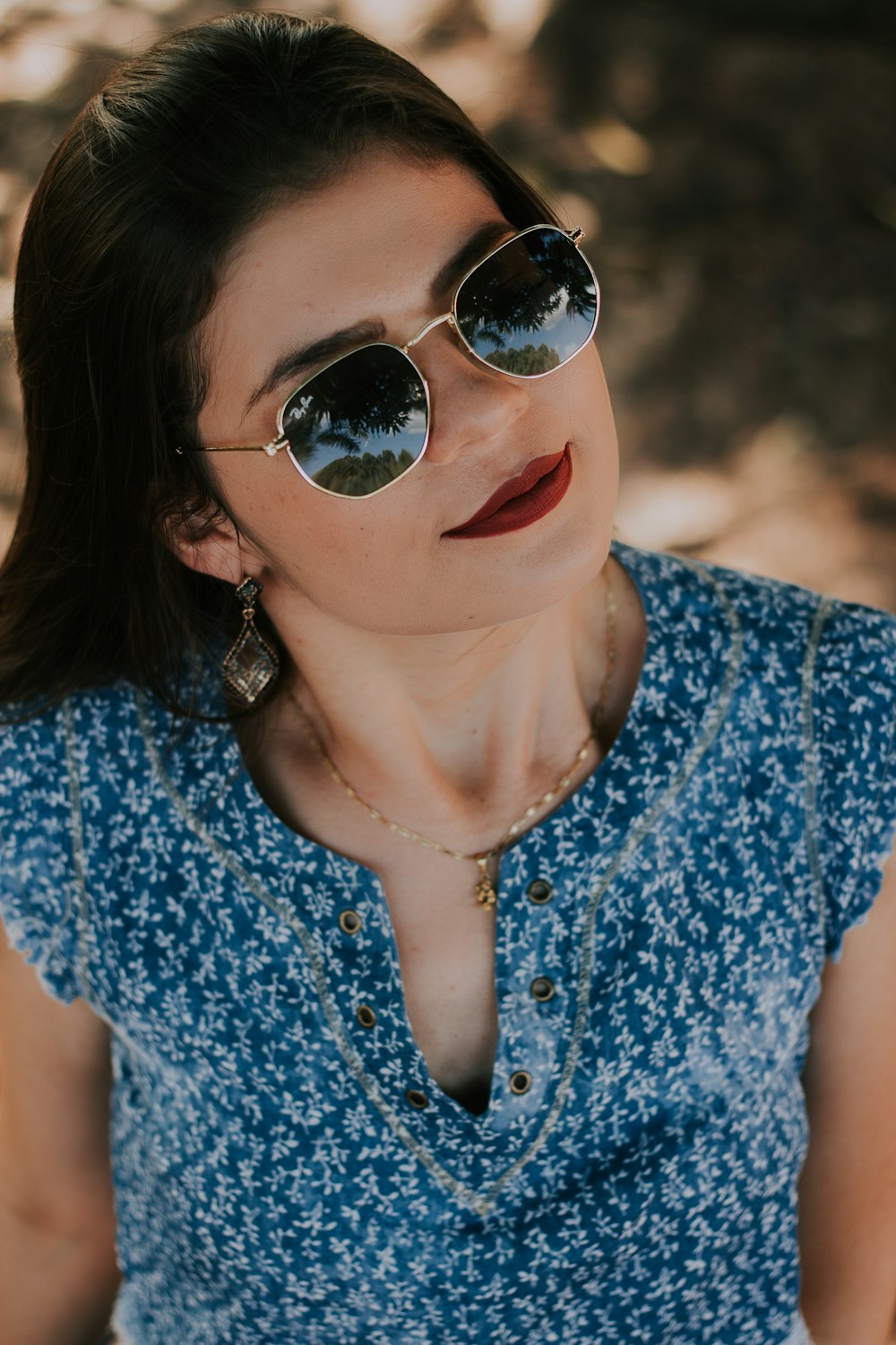 woman wearing blue and white top