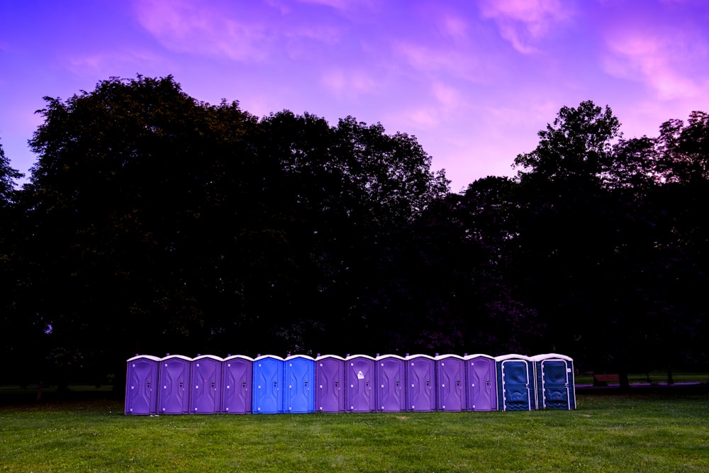 photography of portable toilet on field