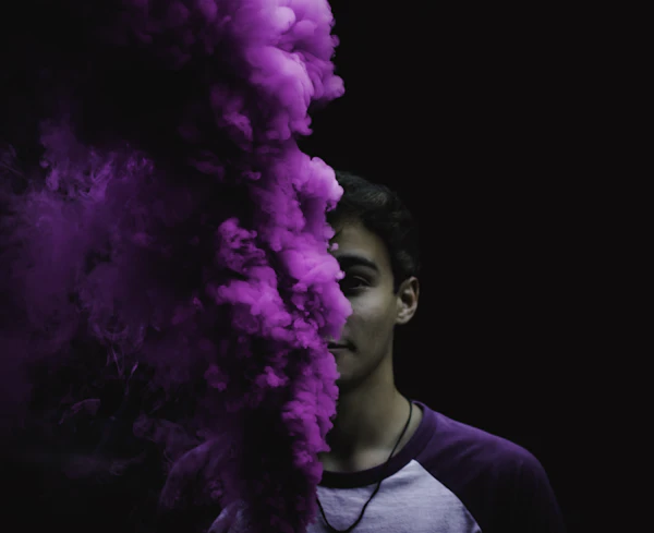 Man with purple smoke — botanical vape experience