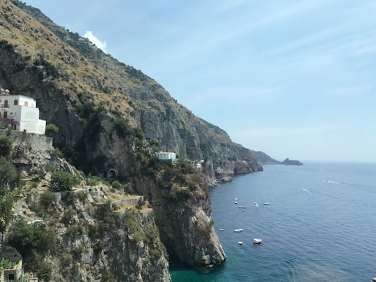 mountain next to body of water in Amalfi Coast Italy