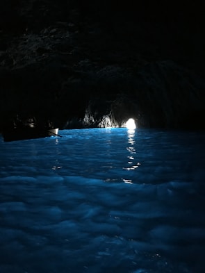 Screenshot of a character navigating a mysterious glowing cave.