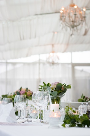 clear long-stem wine glasses on table