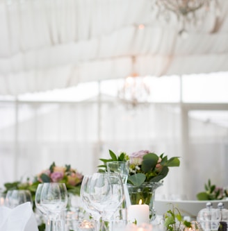 clear long-stem wine glasses on table