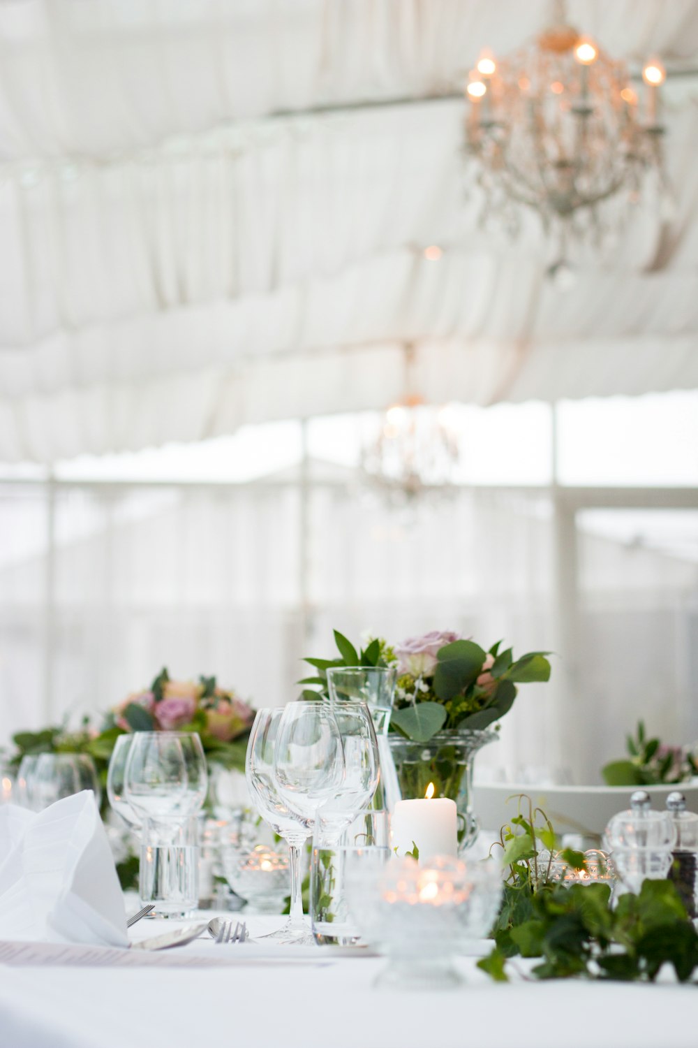 clear long-stem wine glasses on table