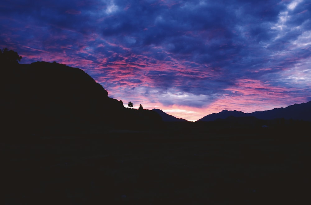 silhouette of mountain during sunset