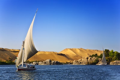 white sailboat on water under blue cloudy sky during daytime photo egypt google meet background