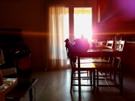 A bright kitchen adorned with sheer curtains for soft light.