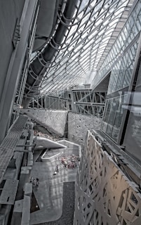 grayscale photography of people inside building
