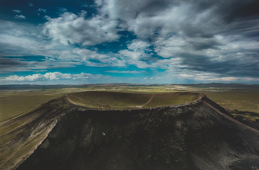 crater under blue cloudy sky during daytime