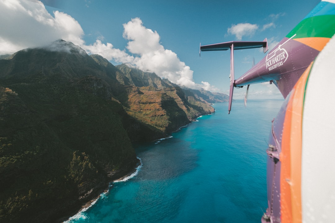 brown hill near ocean under blue and white sky, The Chopper