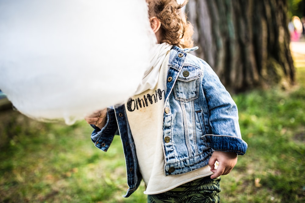 baby wearing blue denim jacket