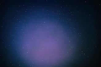 A minimalist cosmic landscape with subtle stars and nebulae illustrating expansive brand universes.