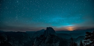 snow-covered mountain during a twilight sky