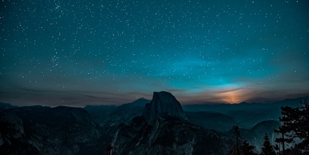 snow-covered mountain during a twilight sky