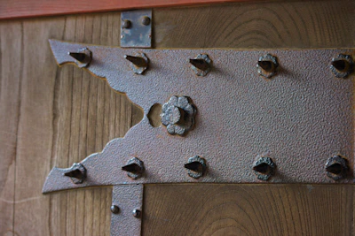 Close-up of secure bolts and fittings on a weight bench installation.