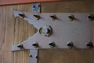 Close-up of a heavy-duty metal TV mount with a smooth matte finish.