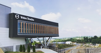 A panoramic view of the Van Sverigen Group headquarters with logos of its affiliated companies displayed.