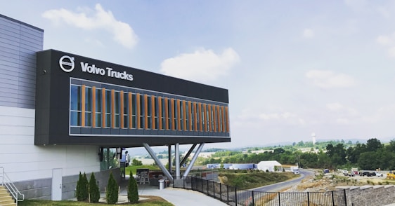 A panoramic view of the Van Sverigen Group headquarters with logos of its affiliated companies displayed.