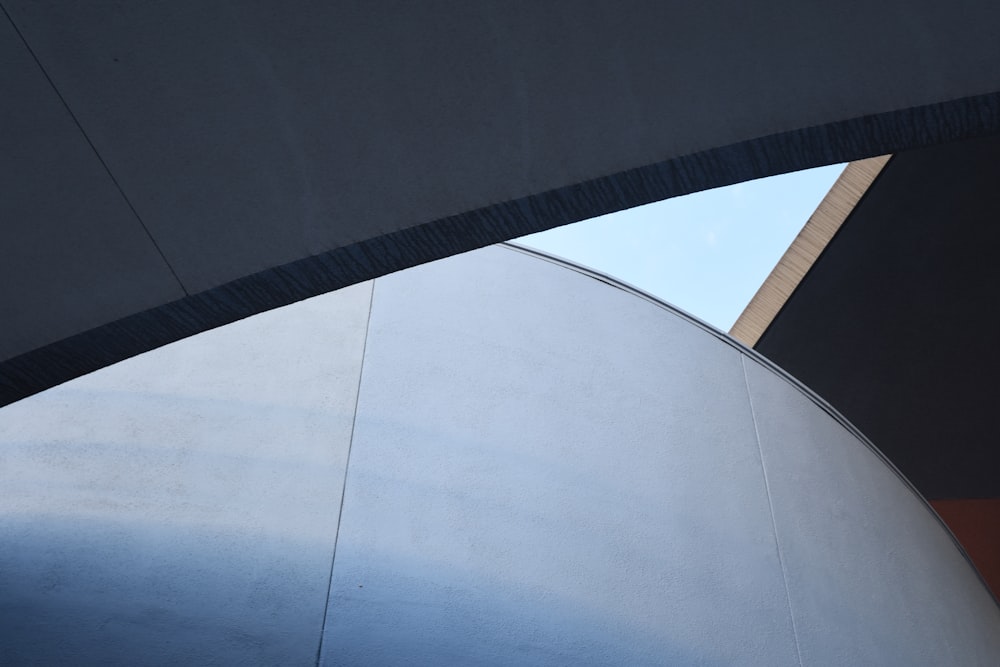 a close up of a metal structure with a sky in the background