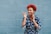 woman smiling while pointing on her right side