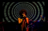woman singing on stage