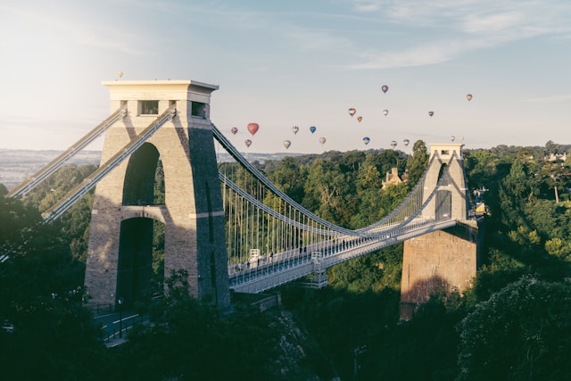 hot air balloons flying above Clifton suspension bridge