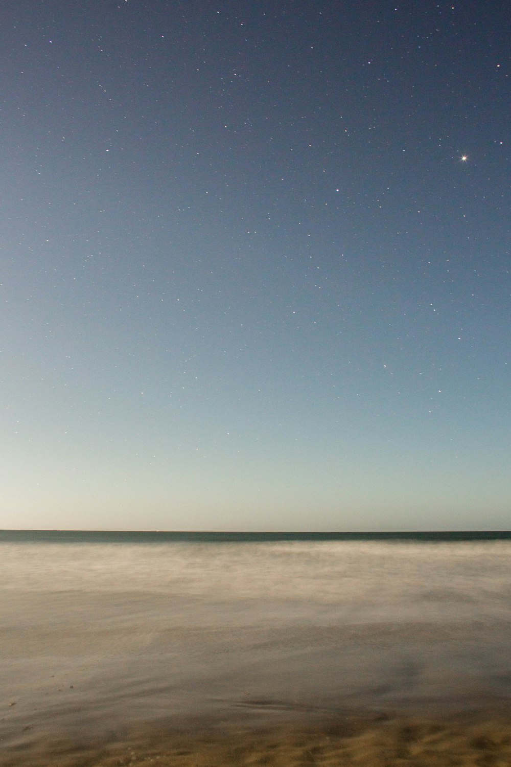 body of water under starry night