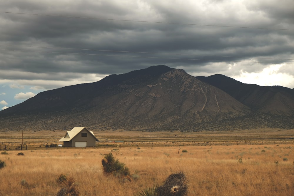 wooden house near mountain ranges