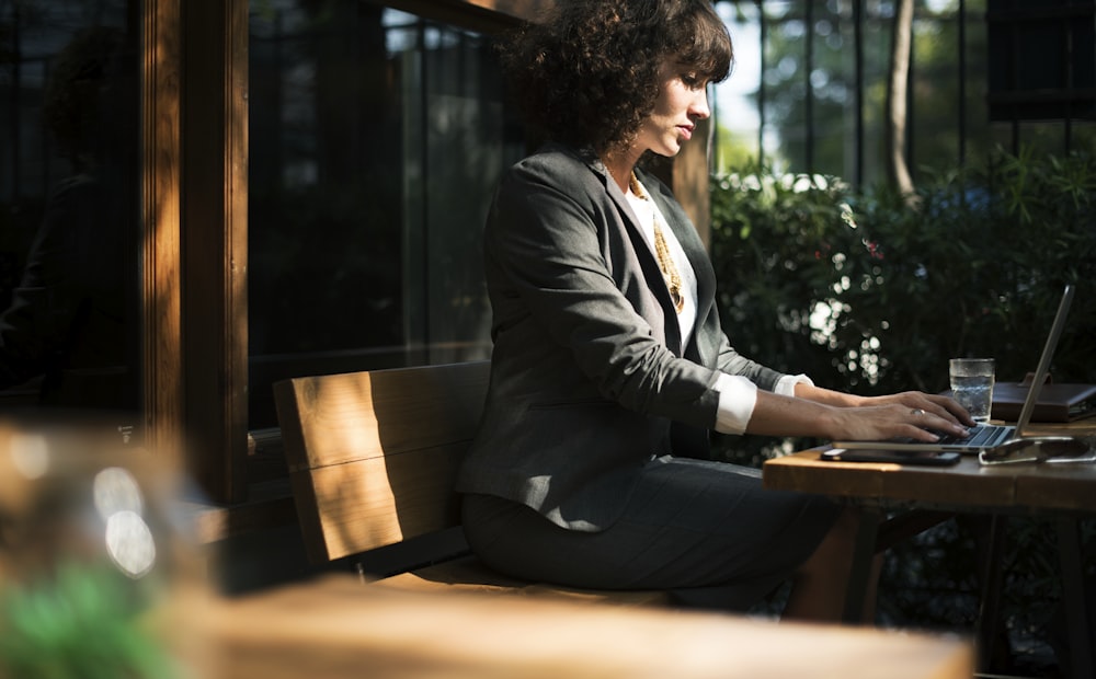 woman typing laptop computer