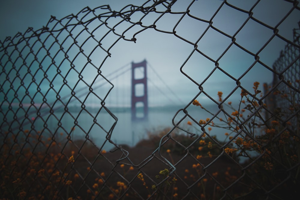 view a fence hole of San Francisco bridge
