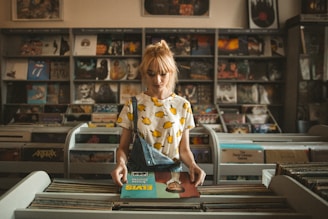 musician holding Elvis Presley vinyl album