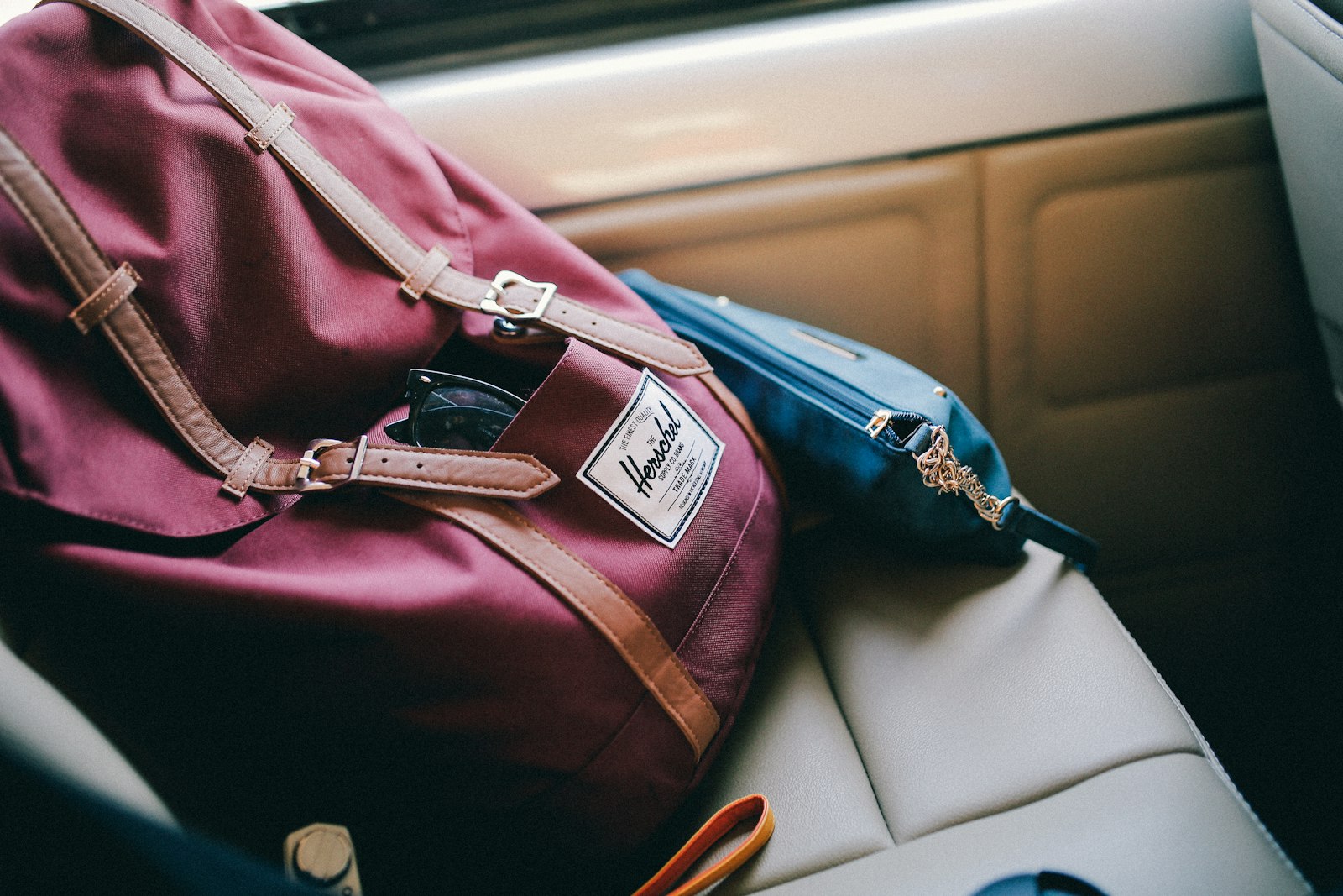 Sigma 35mm F1.4 DG HSM Art sample photo. Maroon herschel bag inside photography